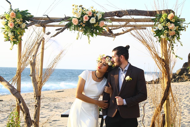 Rustic wedding ceremony arch decorated with wildflowers and greenery at Irish castle venue